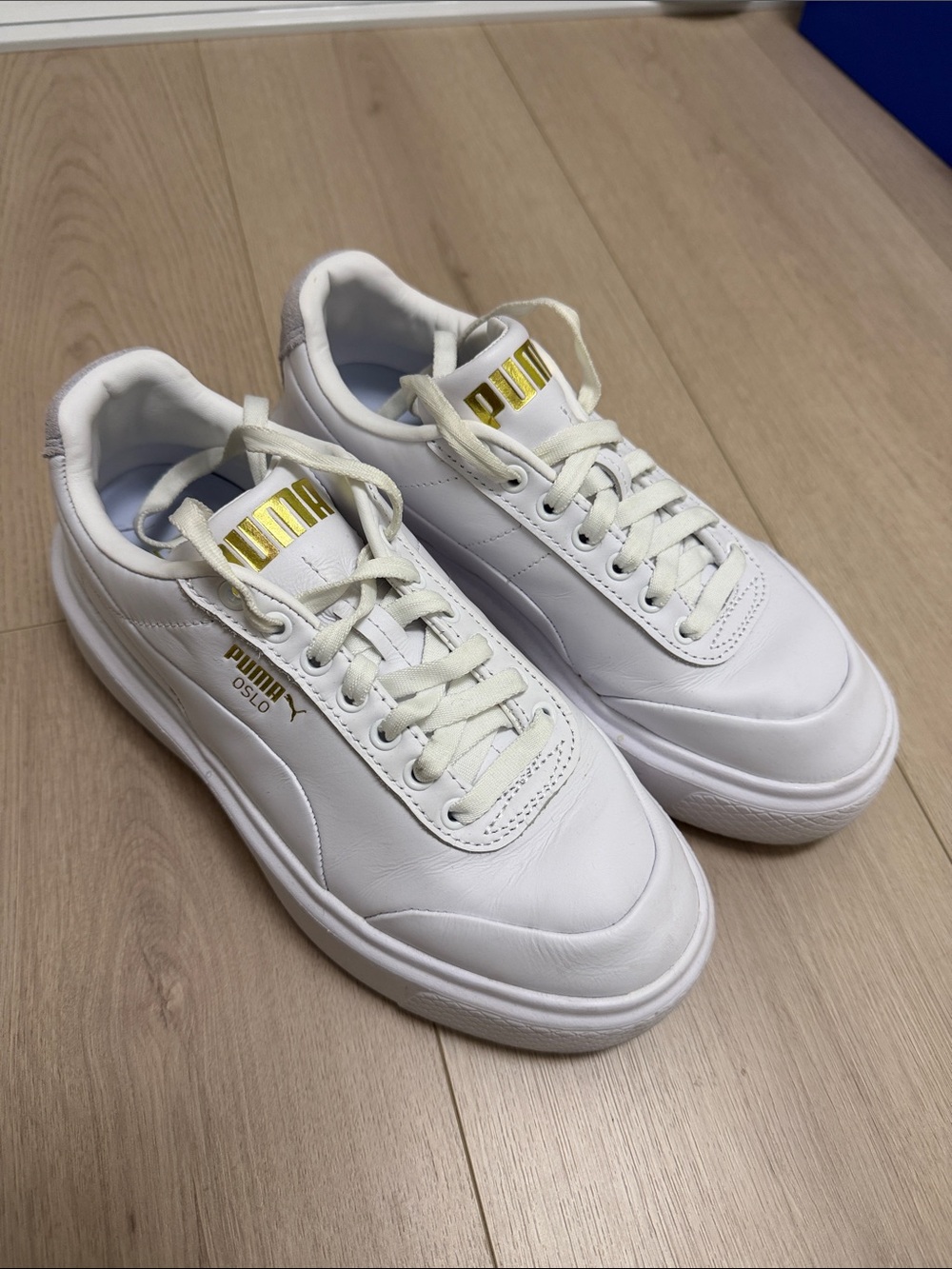 Puma Oslo Women’s White Sneakers with Gold Logo Accents